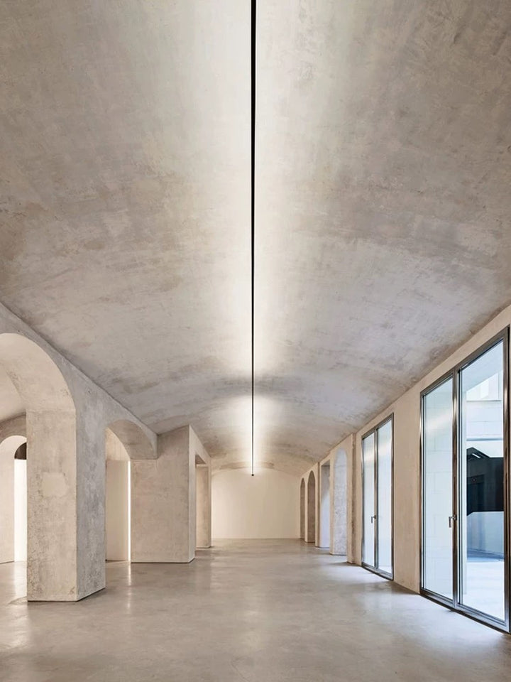 linear LED ceiling light used in a contemporary corridor providing smooth shadow-free architectural illumination