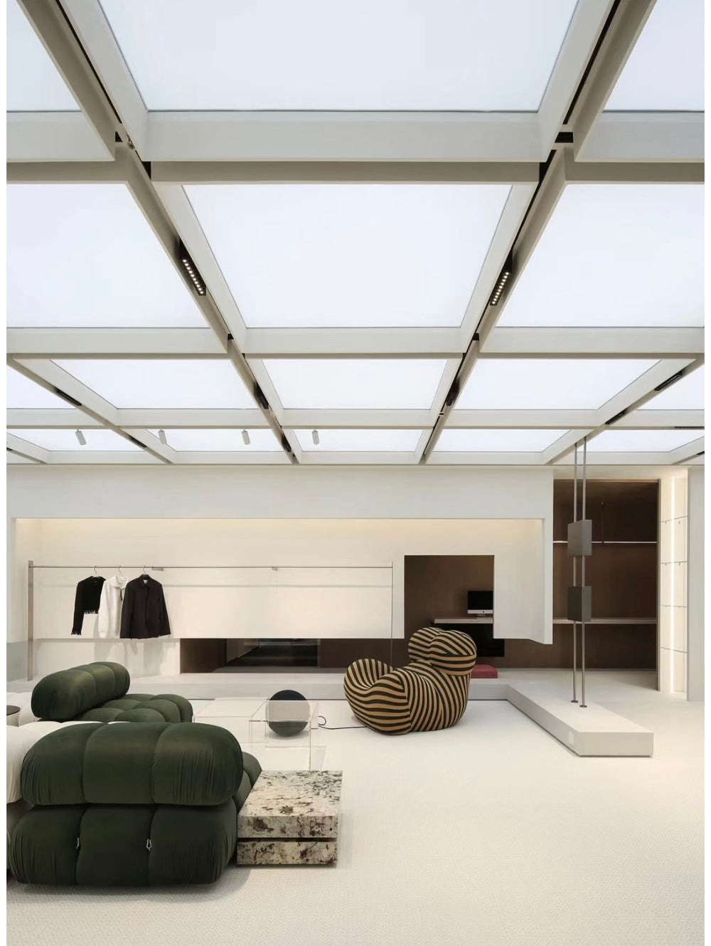 Lucretia backlit stretch ceiling in a grid design for retail interiors and boutique lighting.