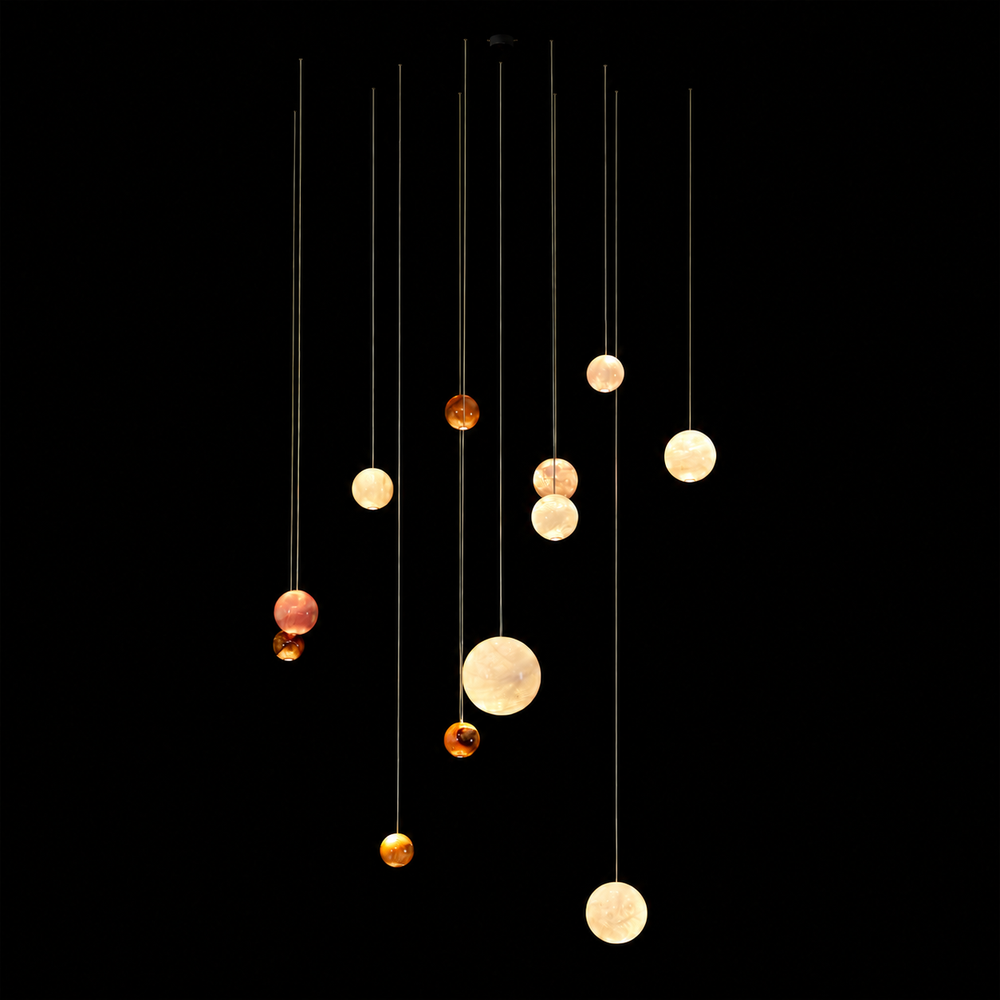 Cosmos natural agate pendant light cluster with handcrafted illuminated stone spheres in custom suspended configuration.