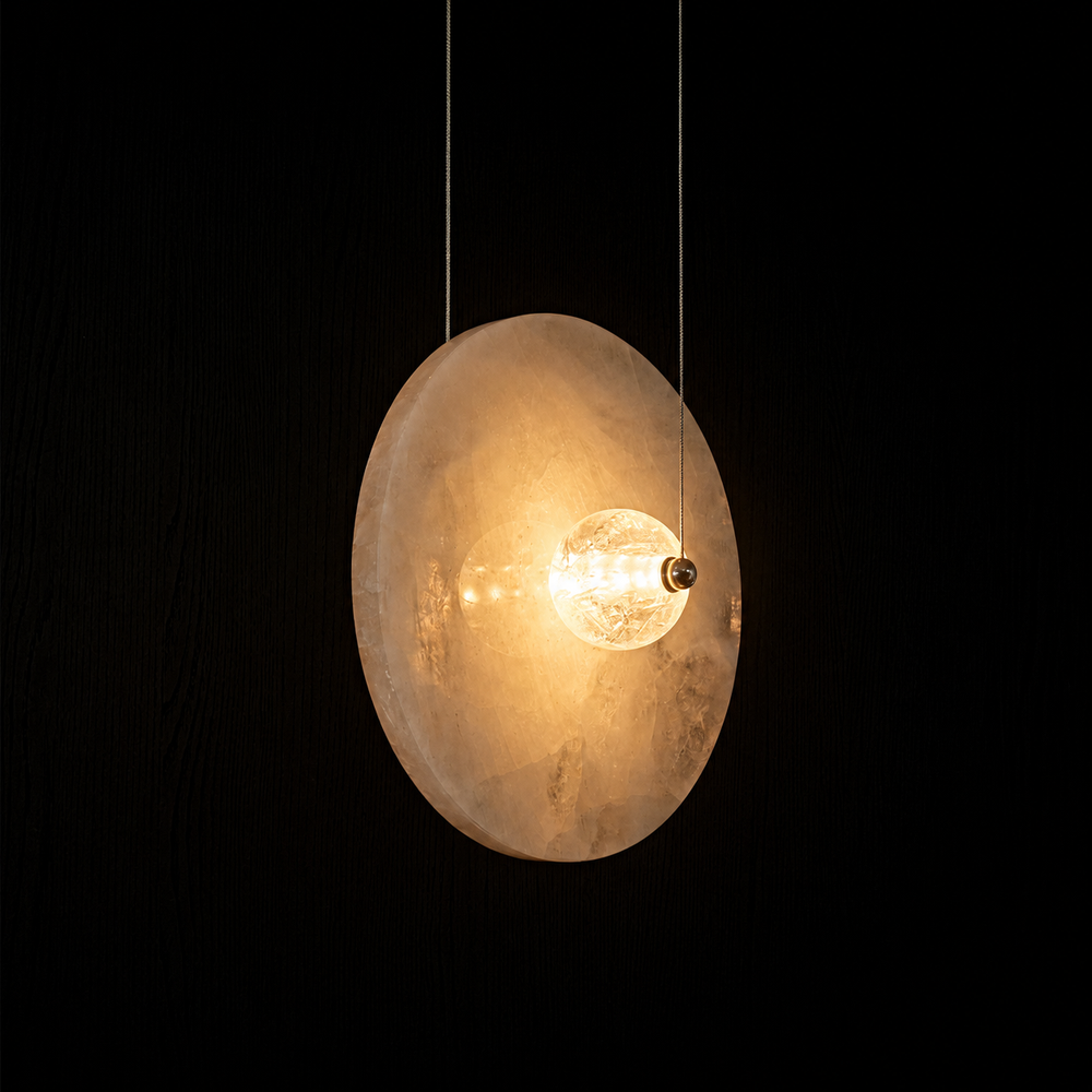 Designer stone pendant light featuring a hand-polished natural stone disc with integrated LED illumination.