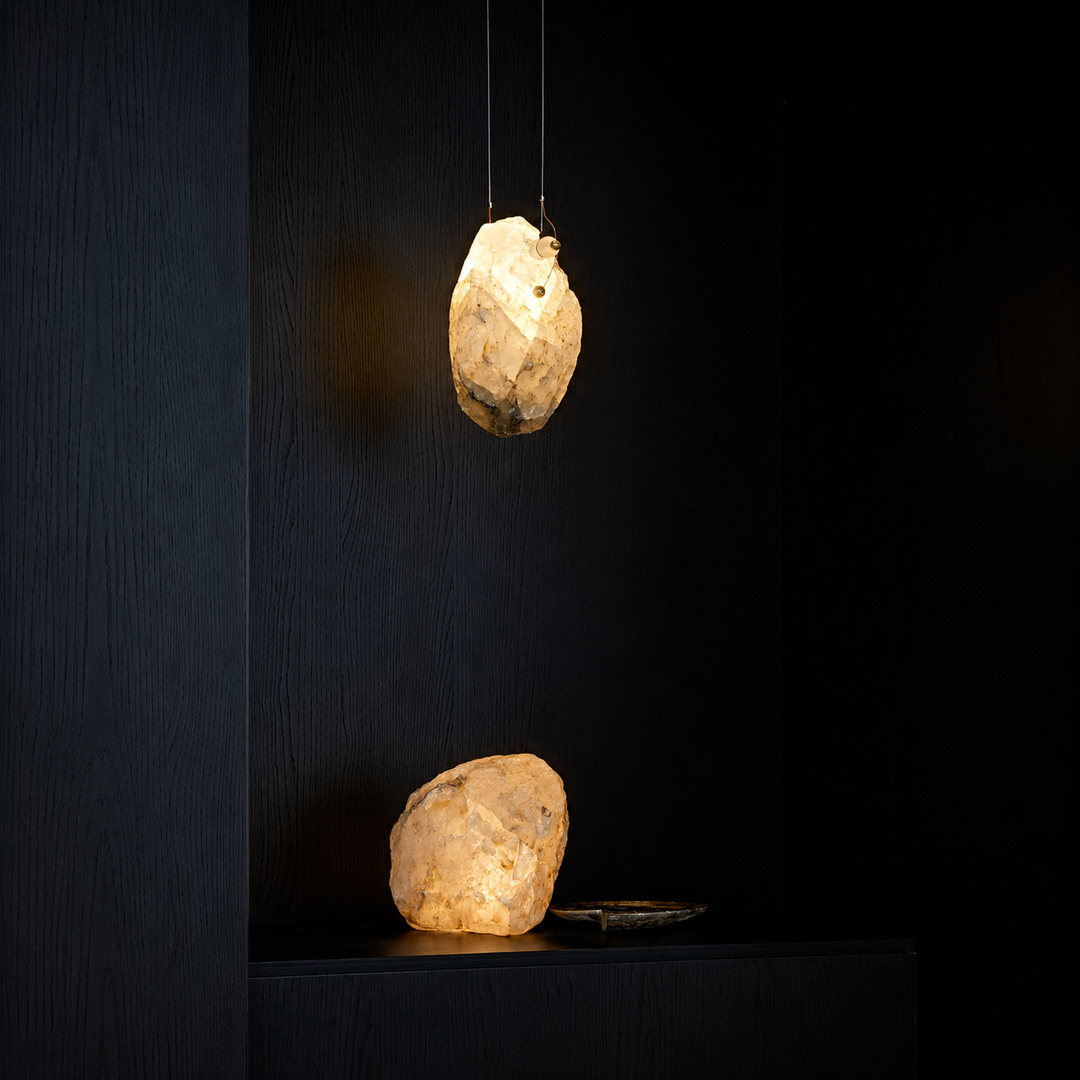 Natural Brazilian crystal pendant light displayed as a sculptural lighting piece with warm ambient illumination.