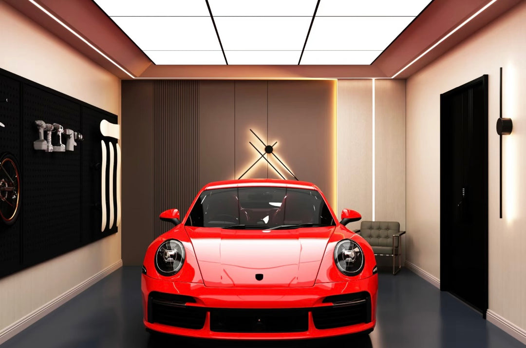 Lucretia stretch ceiling system providing warm, uniform lighting in a high-end vehicle display garage.