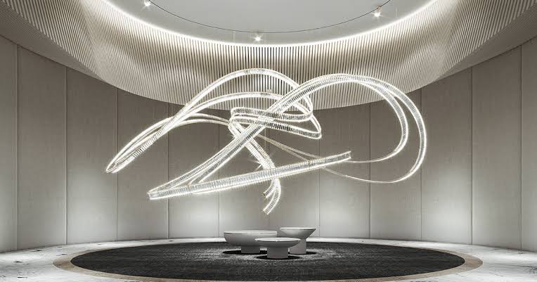 Lucretia Lighting Pharaoh Signature bespoke lighting installed in a commercial foyer showcasing a sculptural LED composition with fluid custom design