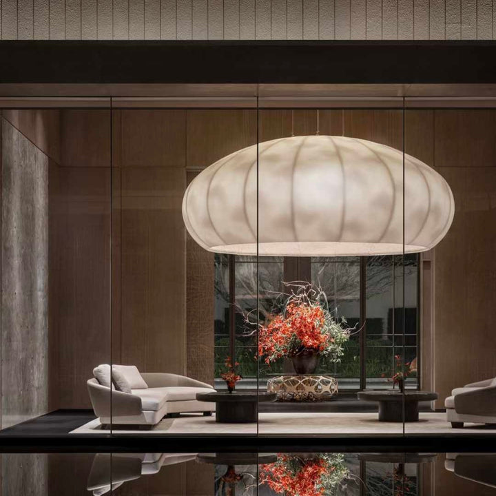 Lucretia Lighting Celestial Cloud bespoke pendant light illuminating a luxury lobby reception area with soft custom lighting and designer cloud-like form