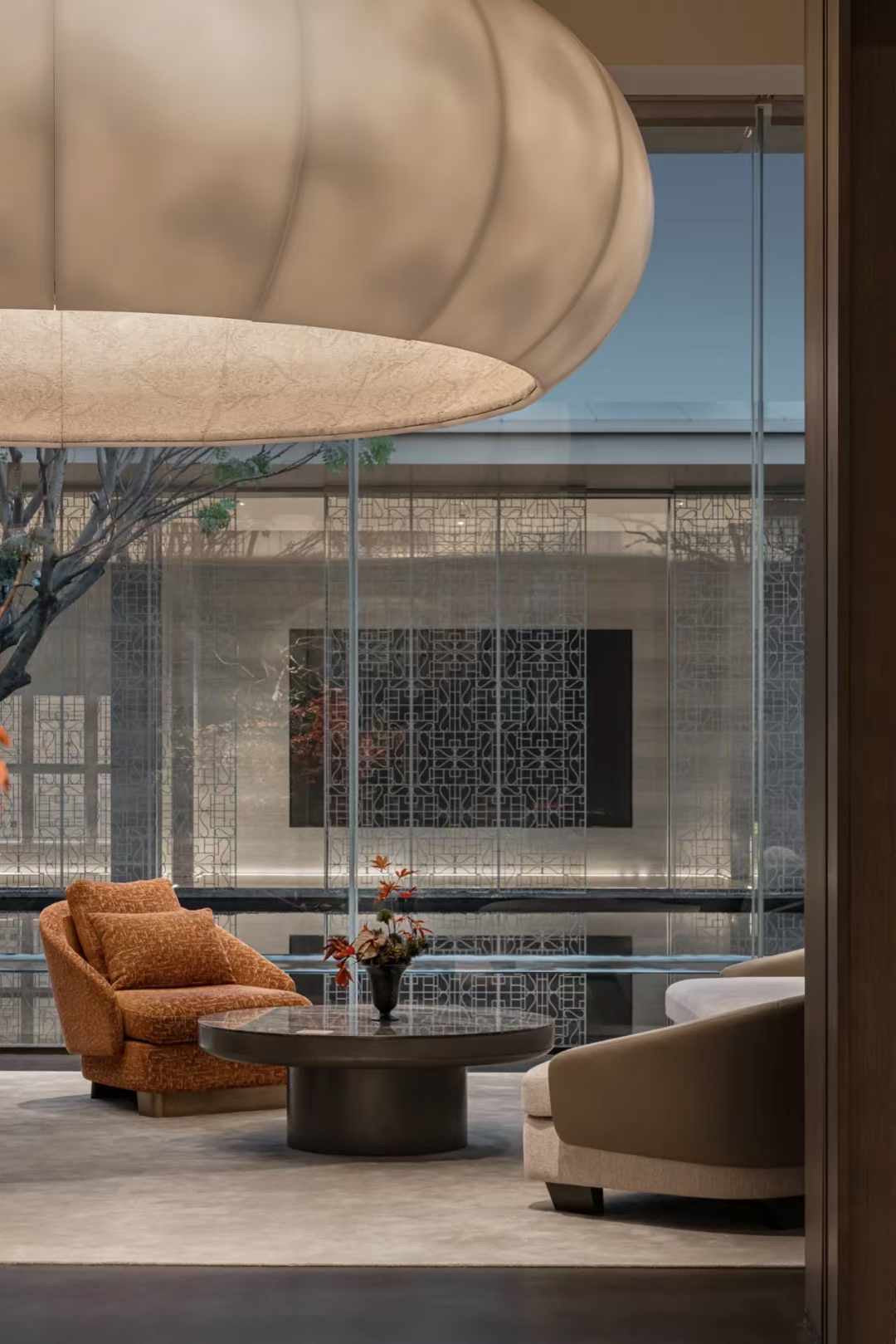 Lucretia Lighting Celestial Cloud bespoke pendant light providing luxury custom lighting to a modern lounge seating area with soft sculptural ambience