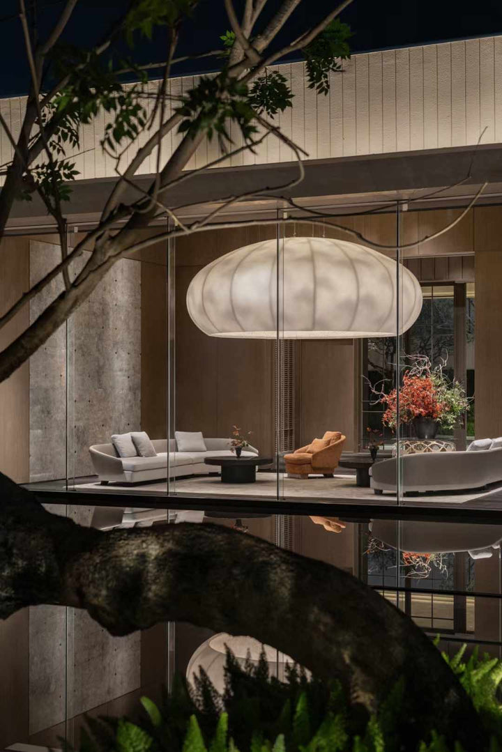 Lucretia Lighting Celestial Cloud bespoke pendant light illuminating a hallway-to-lobby view with luxury custom lighting and elegant designer ambience
