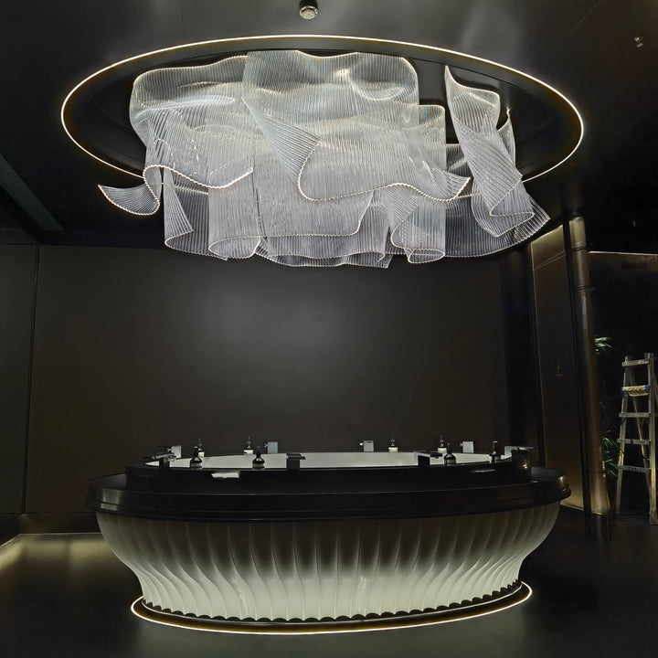 Lucretia Lighting bespoke infinity waves pendant light creating a sculptural luxury custom lighting feature in a grand hotel lobby