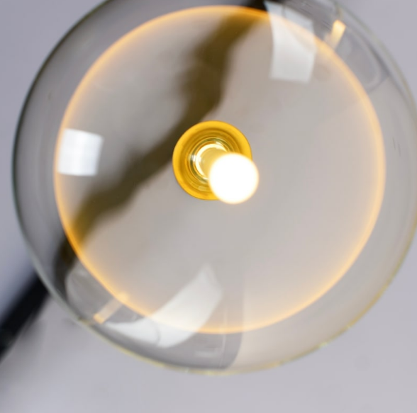 top view of Bolle 5B Pendant Light showing brass details and clear glass sphere craftsmanship by Lucretia Lighting