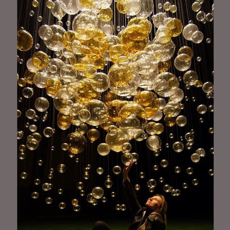 Lucretia Lighting BubbleGlow custom gold glass bubble chandelier used as a bespoke feature light
