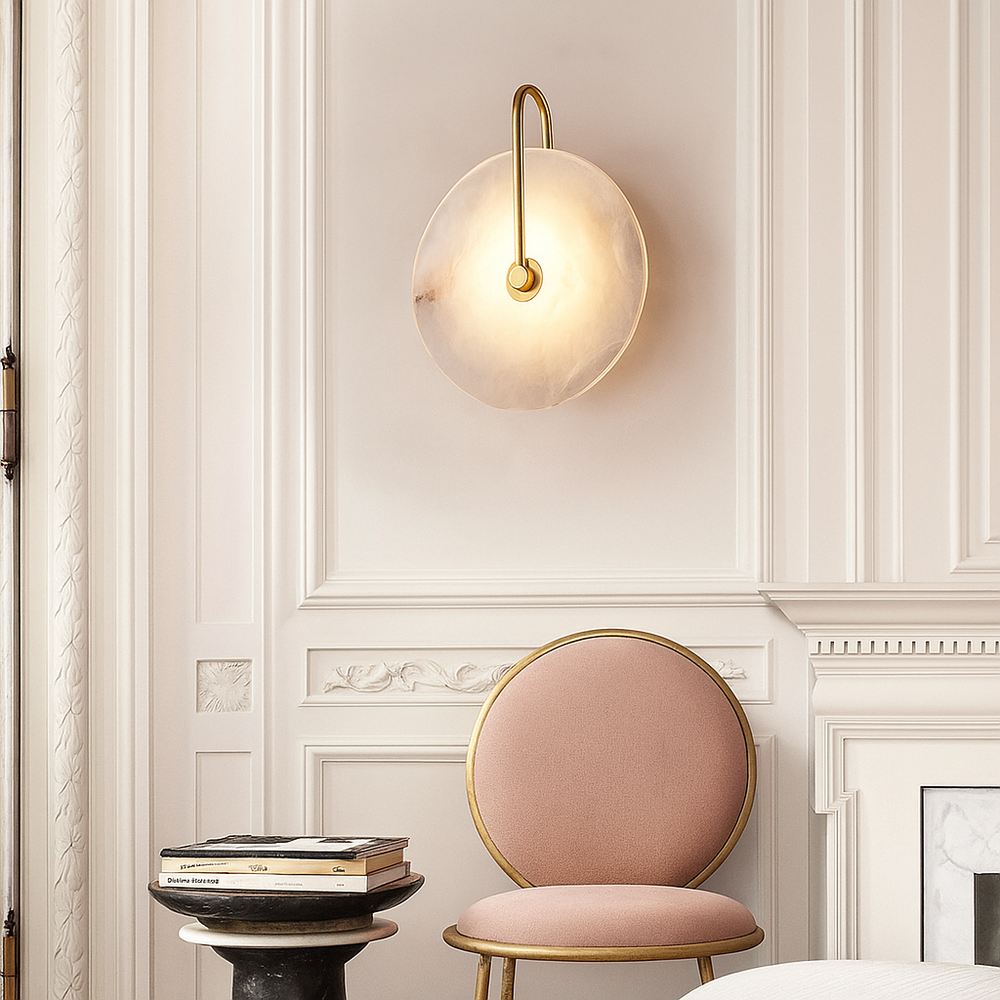 Castilla Glow Alabaster Wall Lamp installed in bedroom scene modern wall light with round Spanish alabaster shade warm ambient lighting for interior decor