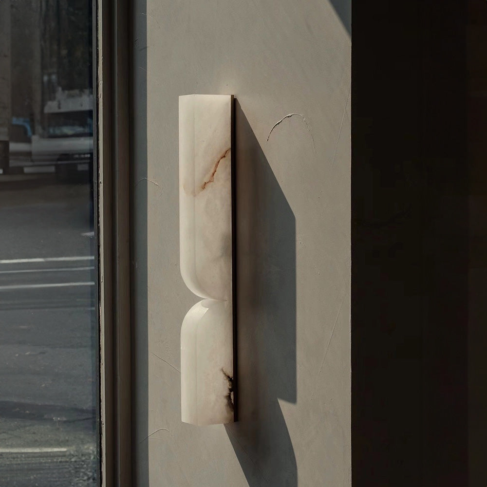 Cordoba 600 alabaster wall light showing natural stone veining and sculptural profile ideal for designer wall lamp and luxury interior lighting.