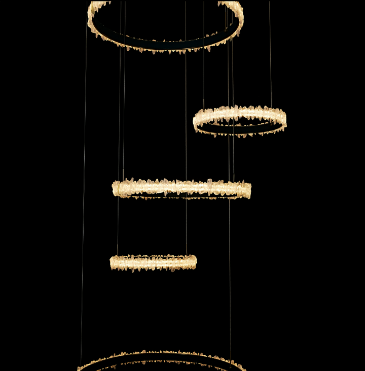 Lucretia Lighting Couro e Cristal bespoke void chandelier with multi ring crystal pendant arrangement for modern architectural interiors