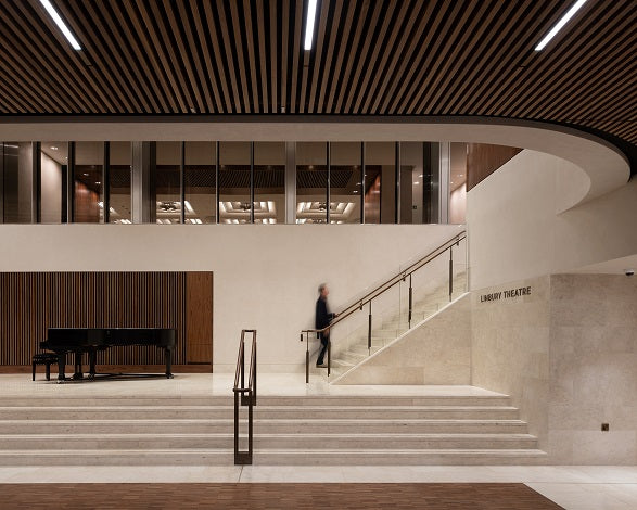 Endless 06011 jointless LED linear system forming seamless continuous wall-to-ceiling lighting for commercial spaces