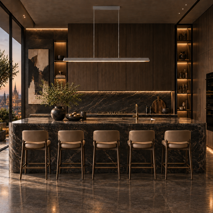 Feldon linear pendant light in khaki off-white above a dark marble kitchen island with timber cabinetry and a dusk city view