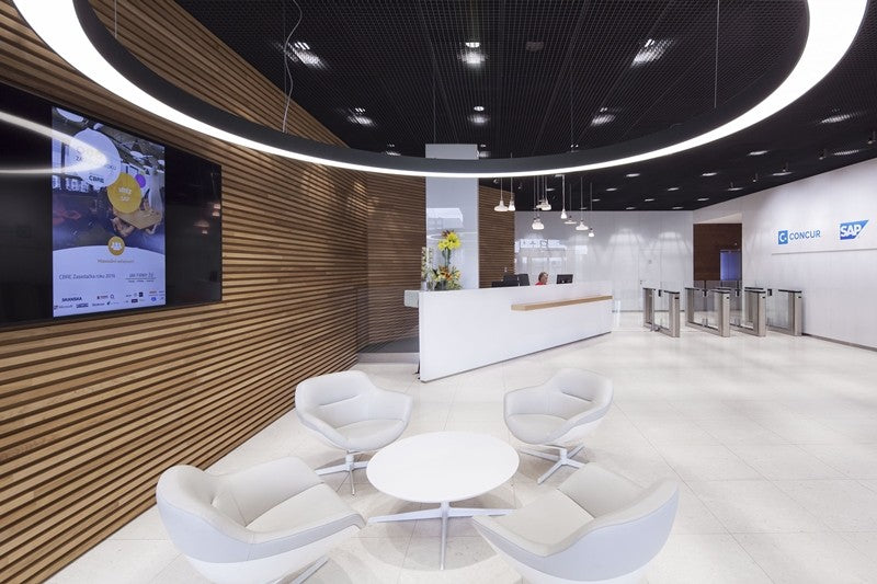 FlexCurve CX100 custom curved LED linear lighting installed as a suspended feature in a contemporary architectural space