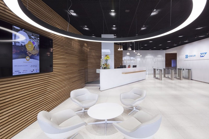 FlexCurve CX100 custom curved LED linear lighting installed as a suspended feature in a contemporary architectural space