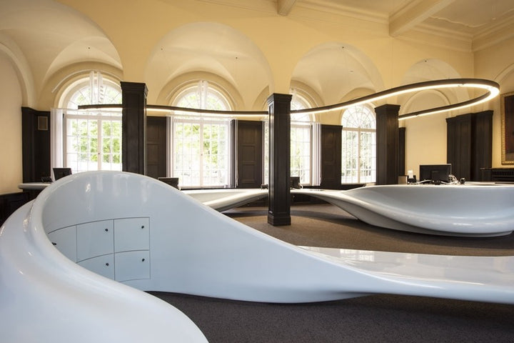 FlexCurve CX80 architectural curved LED linear lighting installed in a retail interior with seamless ceiling integration