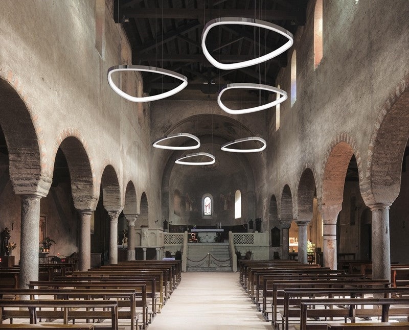 FlexHalo CS50 custom curved LED linear lighting installed in a hospitality interior with sculptural suspended light forms