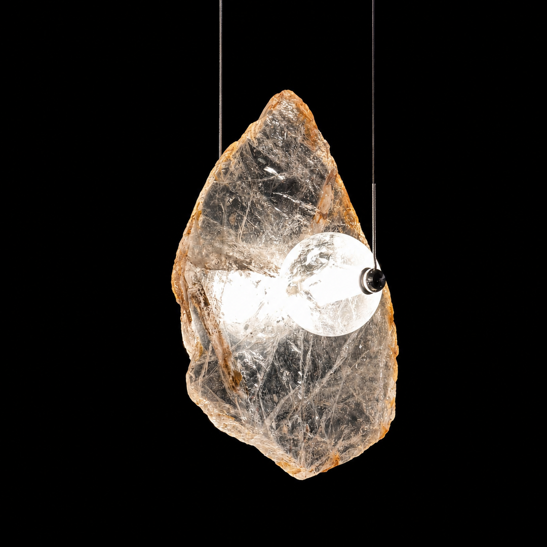 Frozen Earth natural Madagascar crystal pendant light with illuminated glass sphere, luxury architectural lighting side view.