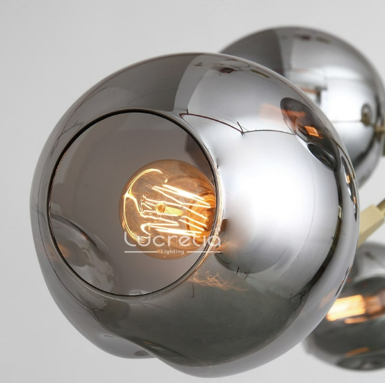 Glass Bubble Pendant 5 by Lucretia Lighting with smoke-tinted glass globe detail and warm illumination