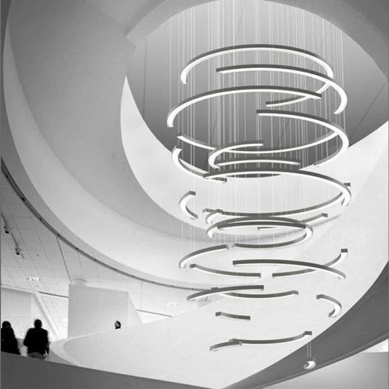 Lucretia Lighting half-ring LED feature light shown as a bespoke sculptural architectural installation