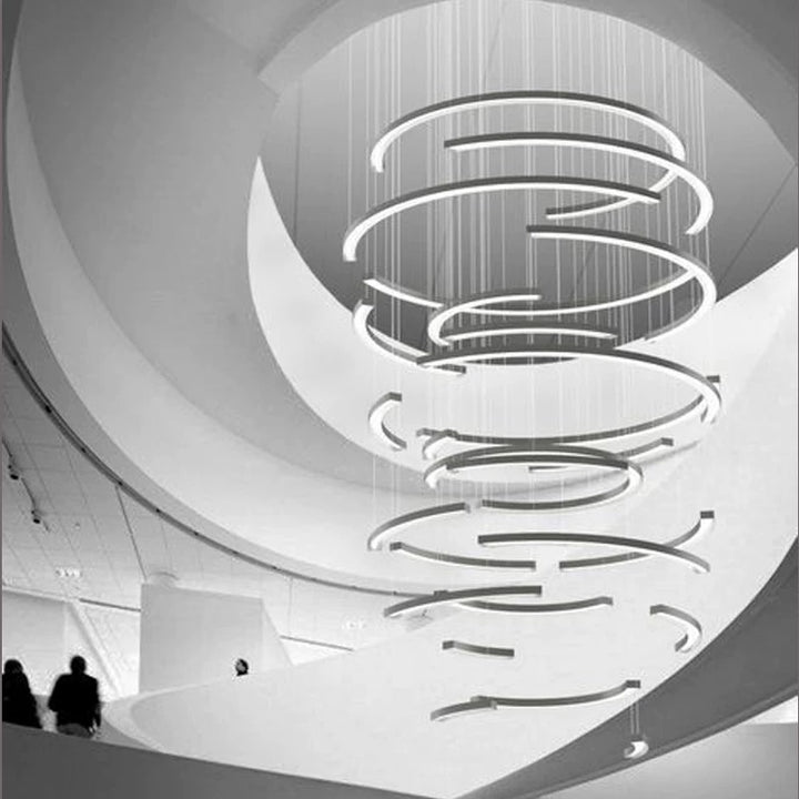 Lucretia Lighting half-ring LED feature light shown as a bespoke sculptural architectural installation