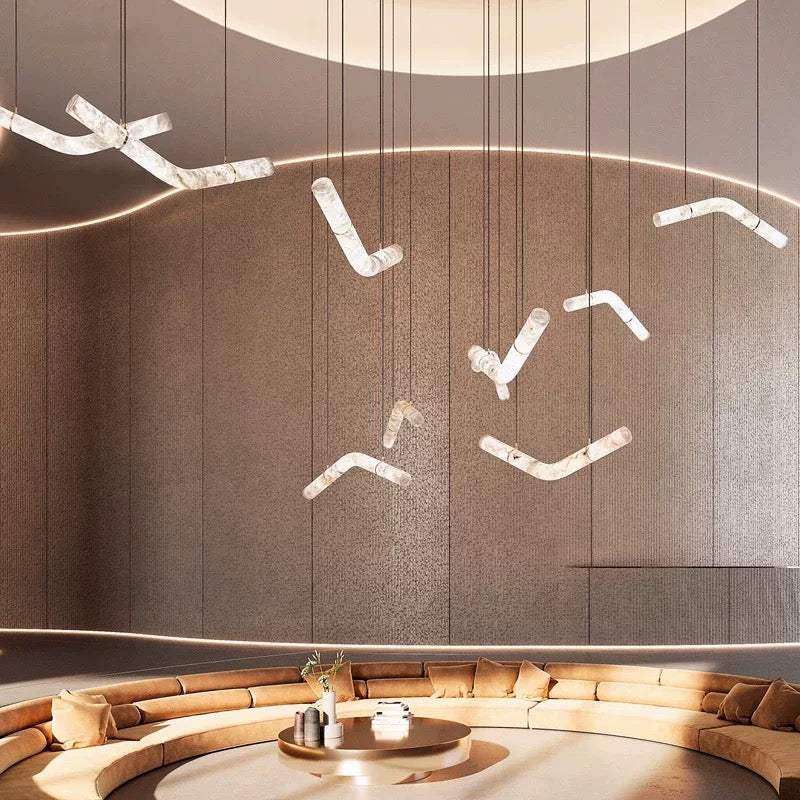 Lucretia Lighting Luma Flow modern luxury alabaster pendant lighting installed in a double height void space with soft ambient glow