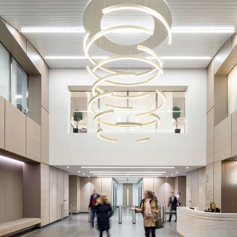 Lucretia Lighting LumiHalf ring bespoke lighting shown as a custom half-ring LED architectural feature in a commercial lobby