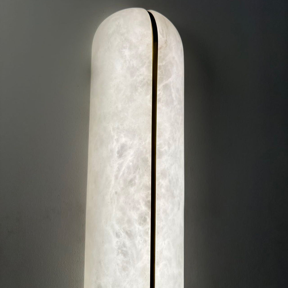 Lumin Edge Alabaster Wall Light slim Spanish alabaster panel detail showcasing soft translucent glow and contemporary brass edge design.