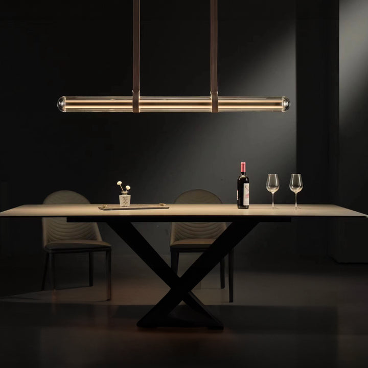 LumiTube designer linear pendant light suspended above a dining table providing refined architectural ambient lighting