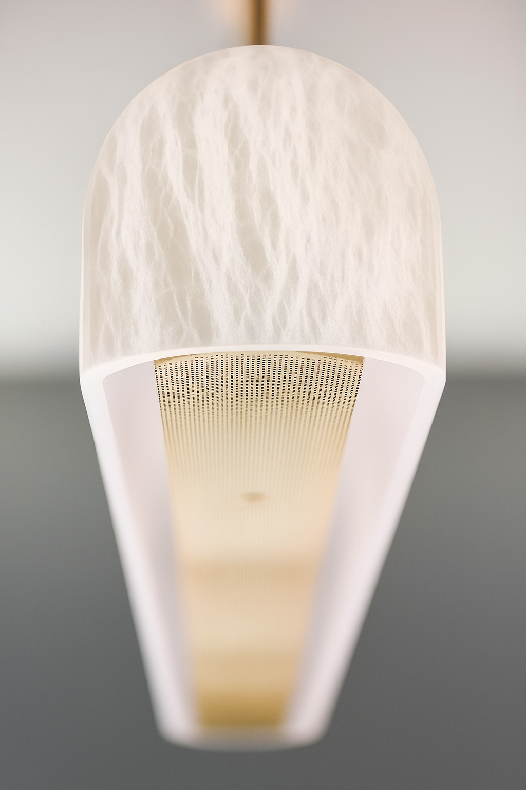 end view of LunaBar modern LED linear pendant light in glowing Spanish alabaster for architectural dining and kitchen lighting