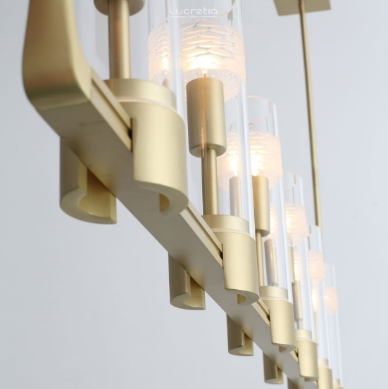 Close-up of Mera Mid-Century Pendant Light 12D glass cylinders with warm LED bulbs by Lucretia Lighting