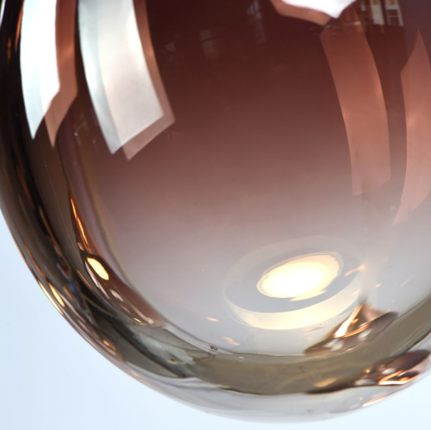 close up of hand blown Swedish glass pendant from the Norden Linear series by Lucretia Lighting