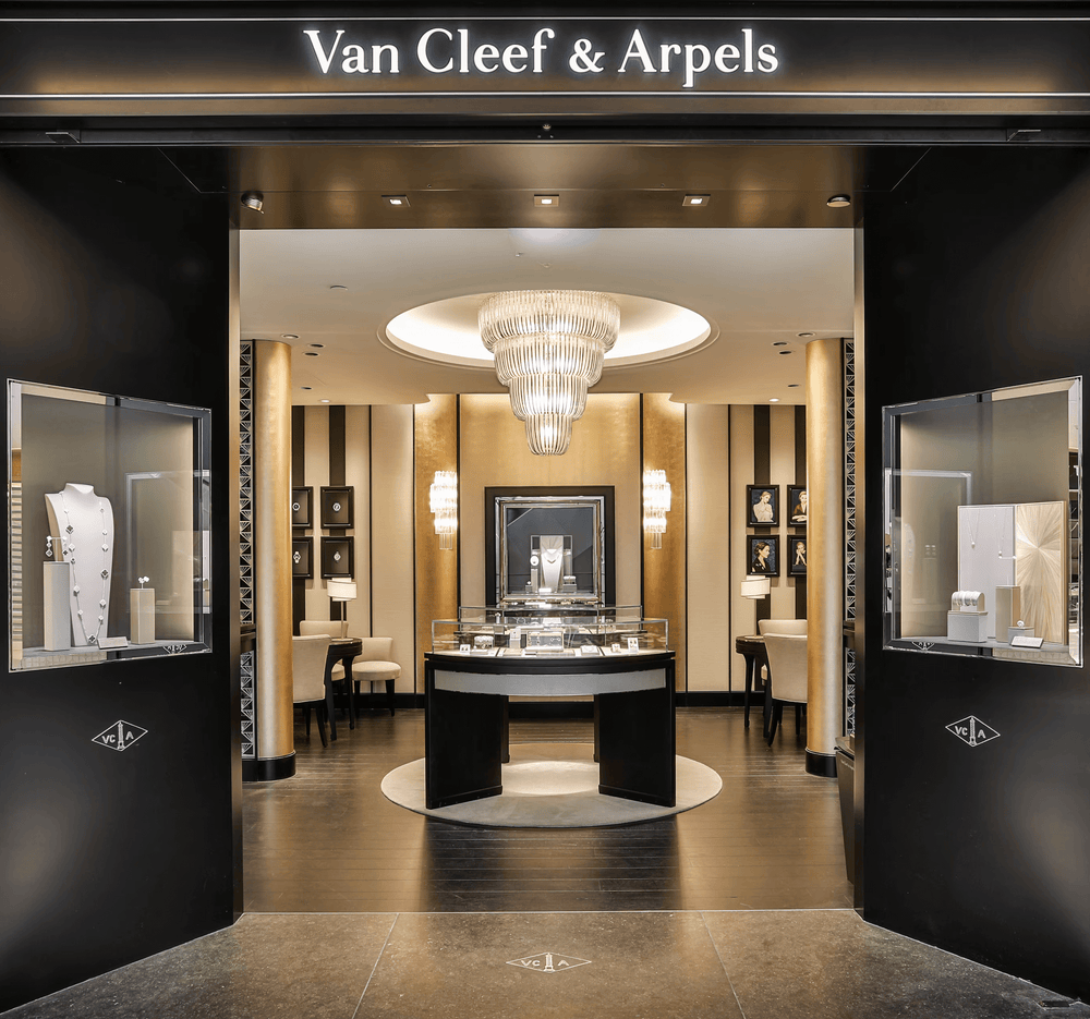 Lucretia Lighting Opus Luxe Chandelier bespoke crystal lighting installed in a luxury retail store interior enhancing high-end ambience