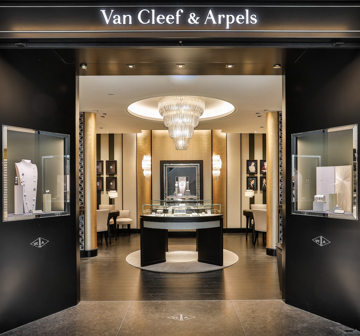 Lucretia Lighting Opus Luxe Chandelier bespoke crystal lighting installed in a luxury retail store interior enhancing high-end ambience