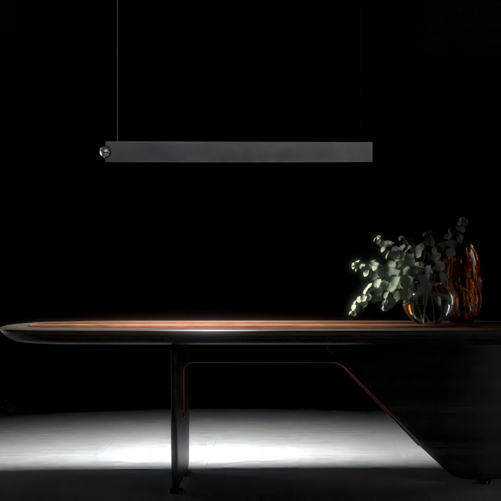 Orbit linear pendant light with touch sensor control providing direct and indirect LED lighting above modern dining table