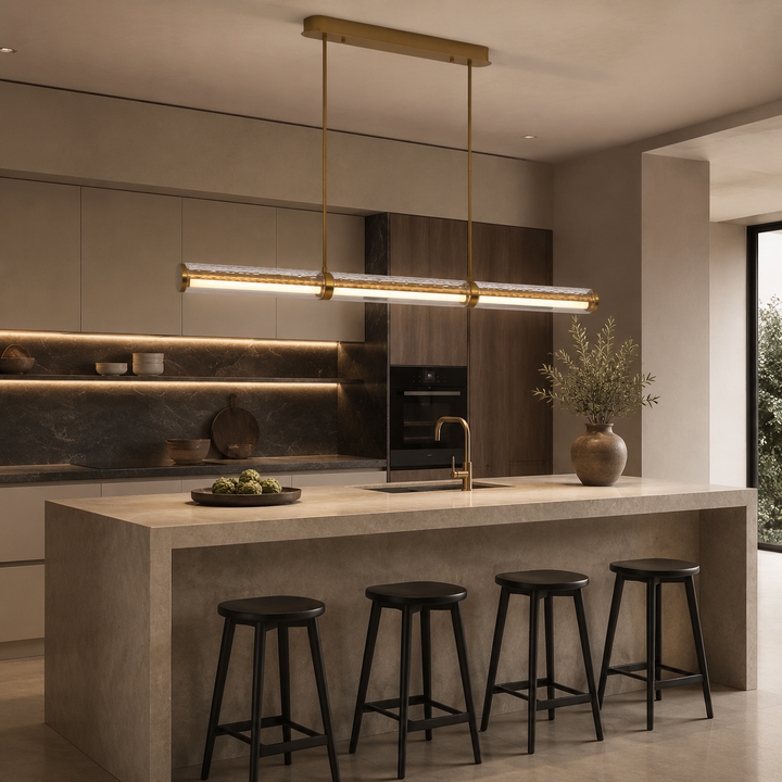 Modern kitchen featuring the Prism Facet Linear Pendant Light with textured European faceted glass, brushed brass finish and soft glare-free LED illumination, ideal for kitchen islands and contemporary architectural interiors.