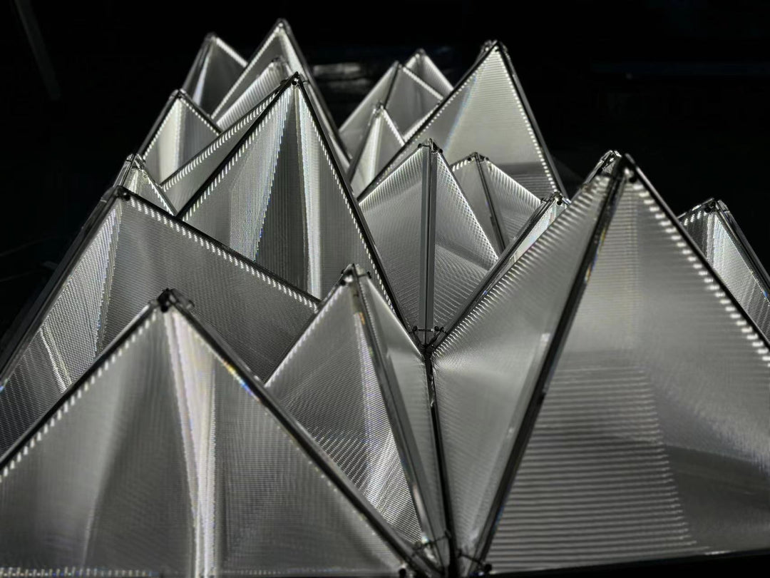 Lucretia Lighting Proteus bespoke geometric lighting ceiling panels shown as a custom installation