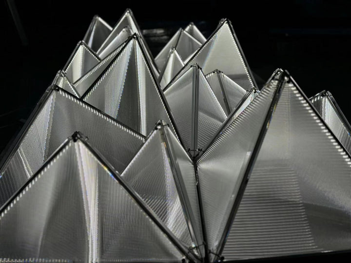 Lucretia Lighting Proteus bespoke geometric lighting ceiling panels shown as a custom installation