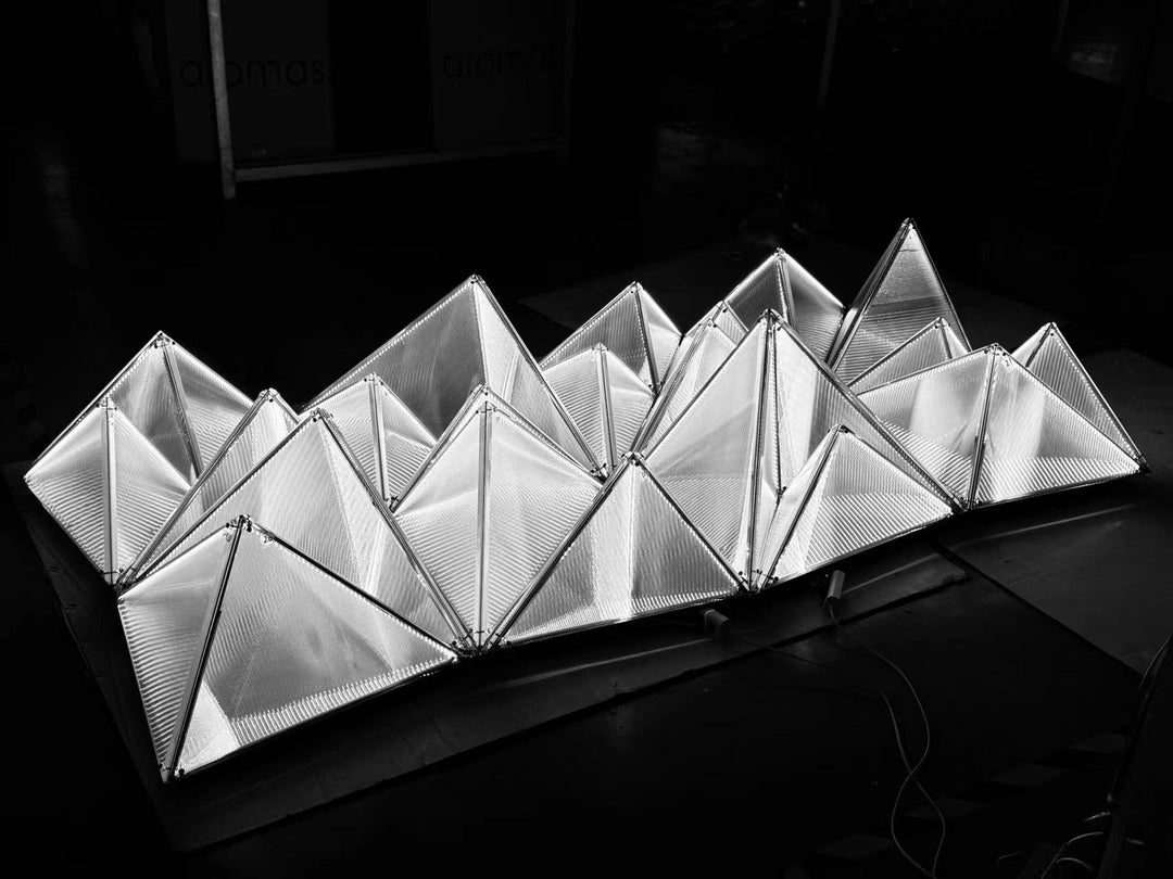 Lucretia Lighting Proteus custom architectural ceiling light displayed as a sculptural feature