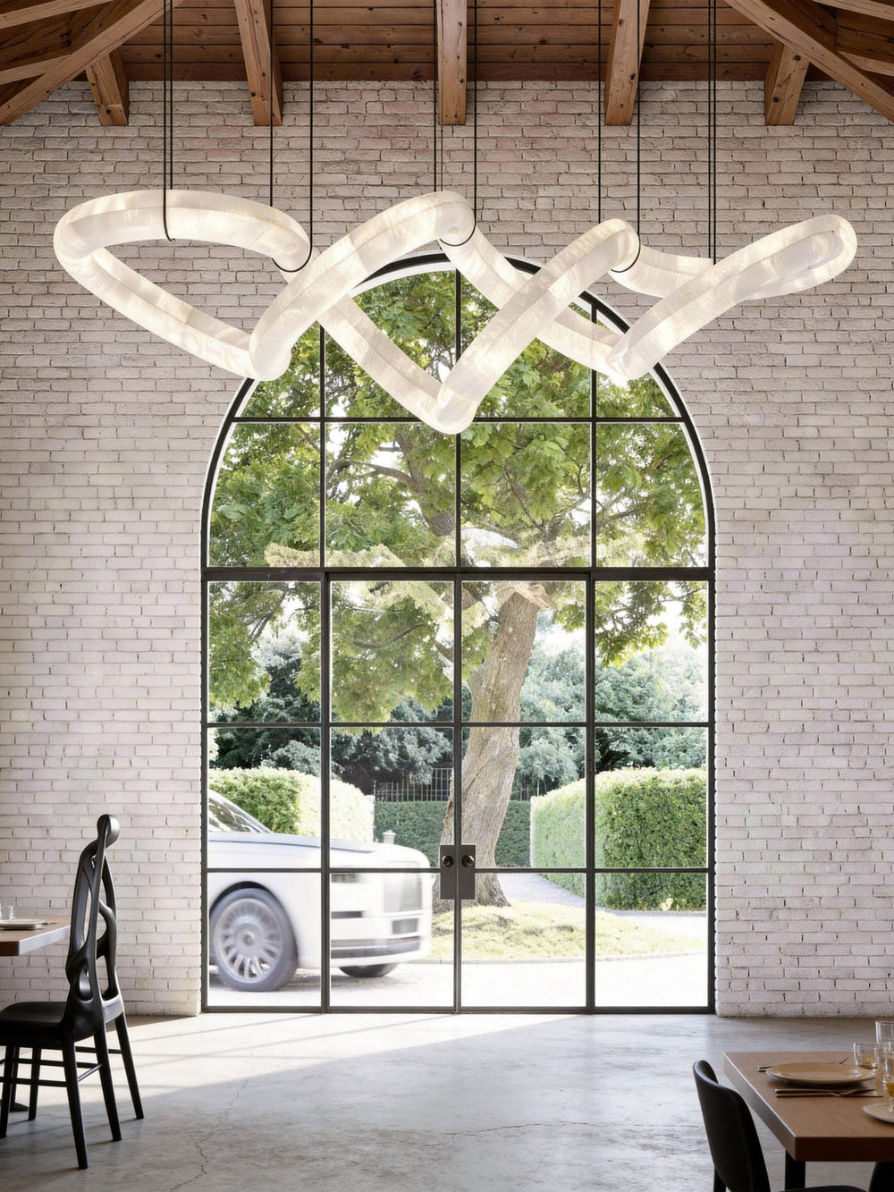 Lucretia Lighting Sereno Twist alabaster custom pendant shown as a bespoke sculptural lighting feature in a luxury architectural interior