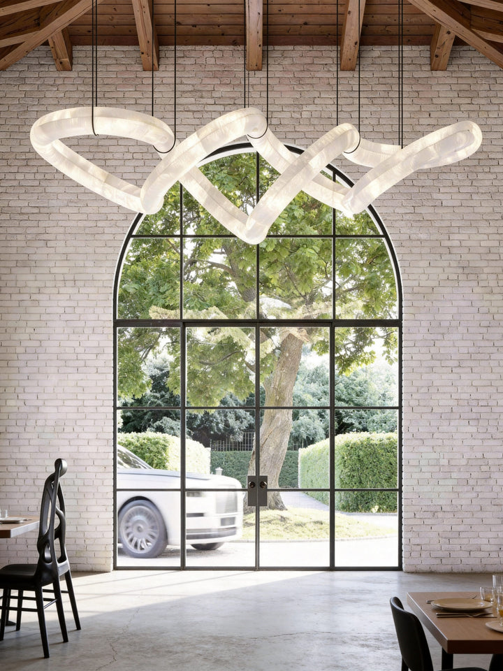 Lucretia Lighting Sereno Twist alabaster custom pendant shown as a bespoke sculptural lighting feature in a luxury architectural interior