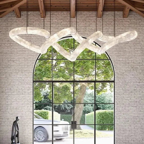 Lucretia Lighting Sereno Twist alabaster custom pendant shown as a bespoke sculptural lighting feature in a luxury architectural interior