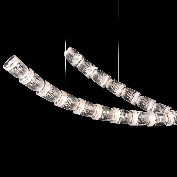 Lucretia Lighting Serpentine Crystal Flow bespoke pendant light shown in a detailed close-up highlighting its custom crystal lighting segments