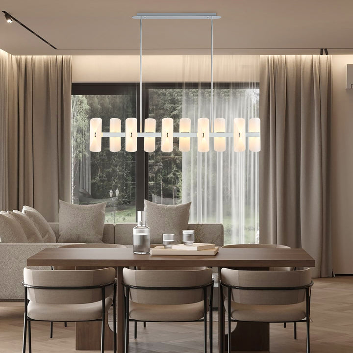 Lucretia Lighting Solvia 1500 linear pendant light installed above dining table with warm amber glass petals in modern interior