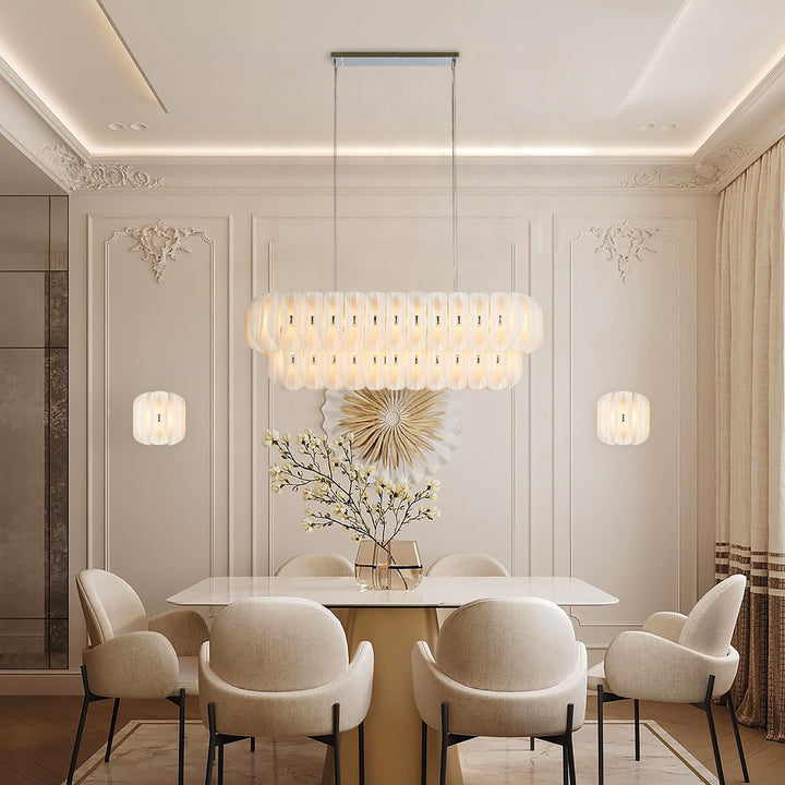 Lucretia Lighting Solvia Cascade 1540 pendant light installed above dining table with warm amber glass glow in luxury dining room