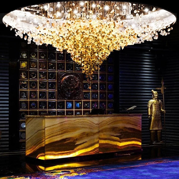 Lucretia Lighting StoneLuxe golden stone bespoke sculpture illuminating a luxury hotel lobby