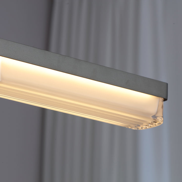 detail view of Striato 5 LED linear pendant highlighting textured glass diffuser and soft even illumination for modern interiors