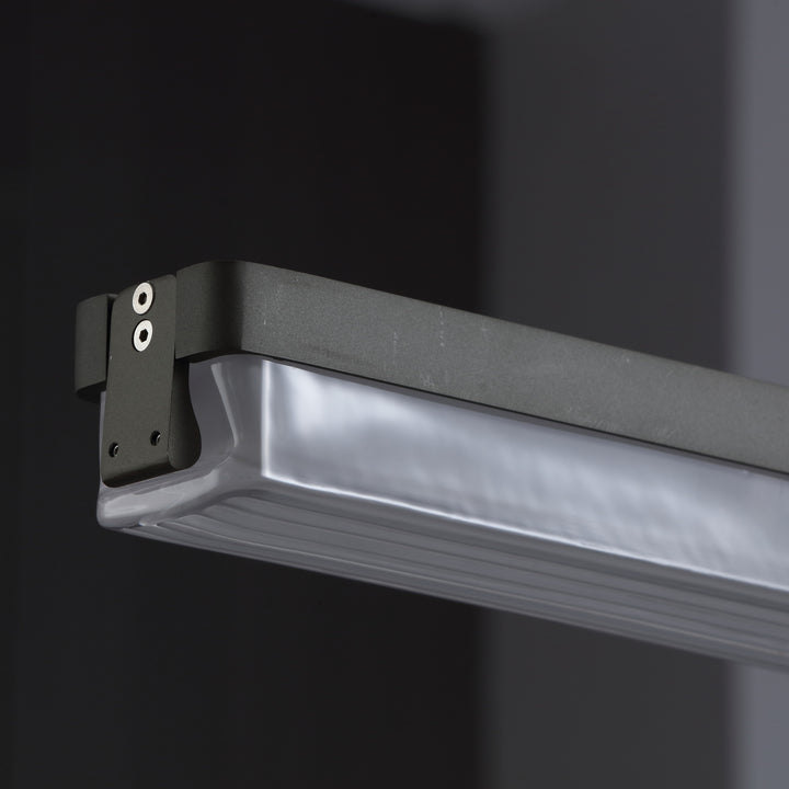 close up of Striato 5 linear pendant with gunmetal finished frame creating clean modern designer lighting for kitchens and dining areas