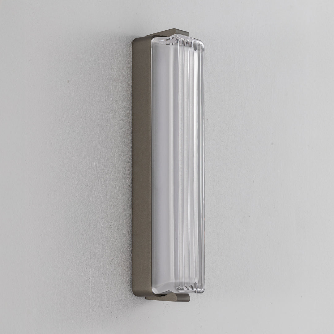 Striato modern wall lamp with slim gunmetal frame and ribbed diffuser designed as an indoor wall light for minimalist contemporary interiors.